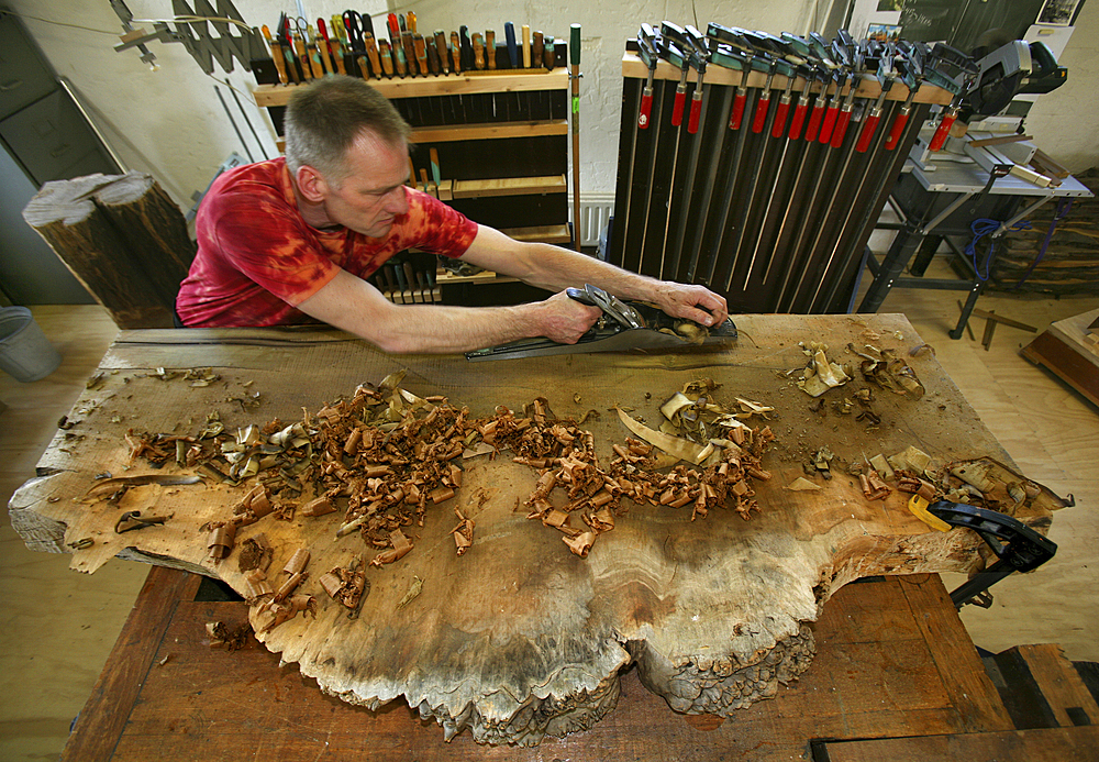 furniture maker at work in his workshop