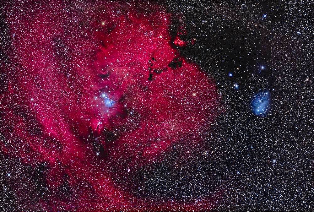 This is the nebula rich region in the constellation of Monoceros the Unicorn with the dark Cone Nebula (left of centre) and the small V-shaped and bright Hubble's Variable Nebula at bottom, a reflection nebula that varies in form and brightness. Above the Cone Nebula is the triangular Christmas Tree Cluster, NGC 2264, here upside down as the bright blue star 15 Mon is the base of the tree. The large region of nebulosity is Sharpless 2-273. The V-shaped dark nebula above centre is LDN 1603.