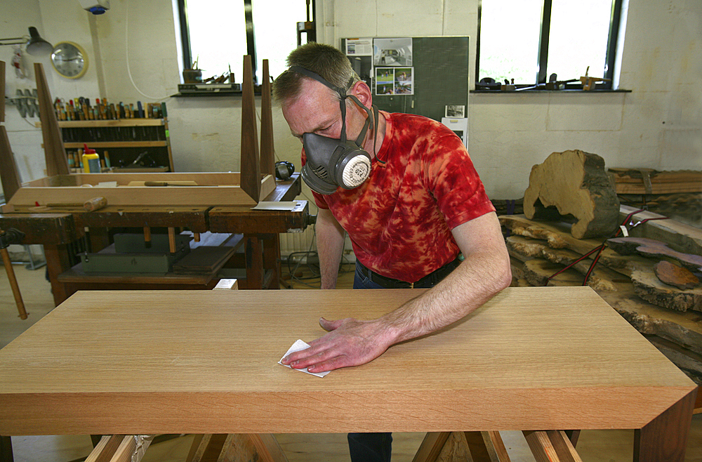 furniture maker at work in his workshop