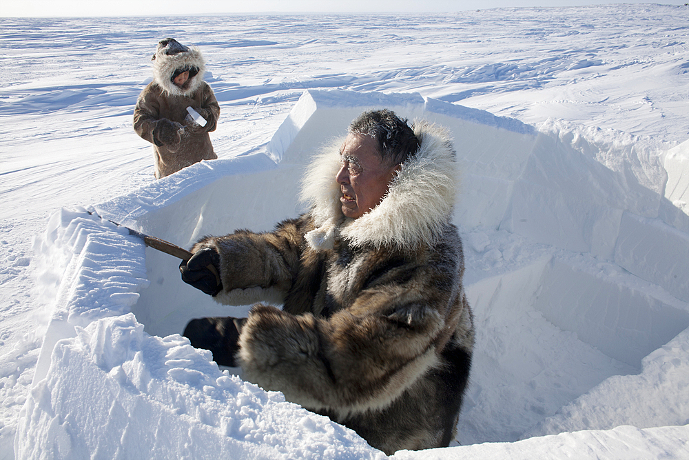 Building an igloo in Gojahaven, an Inuit settlement in the far north of Canada