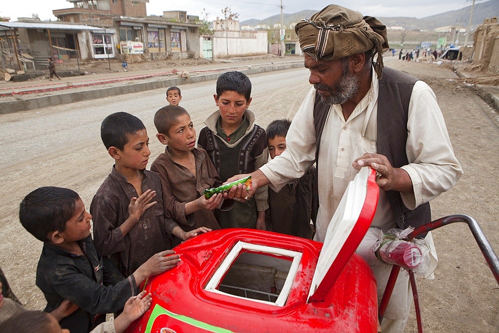 Afghan children at a icecream seller in kabul