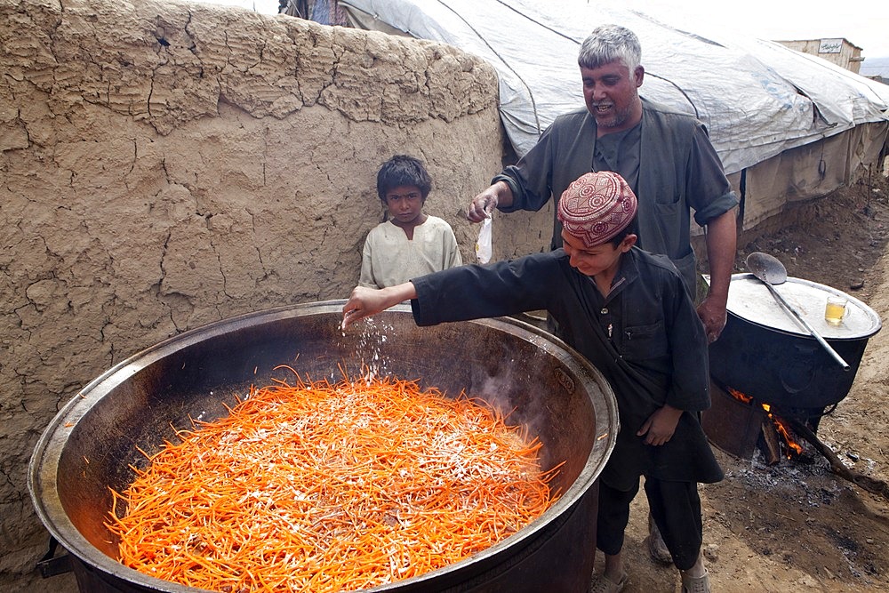 Afghan student gets food at school.