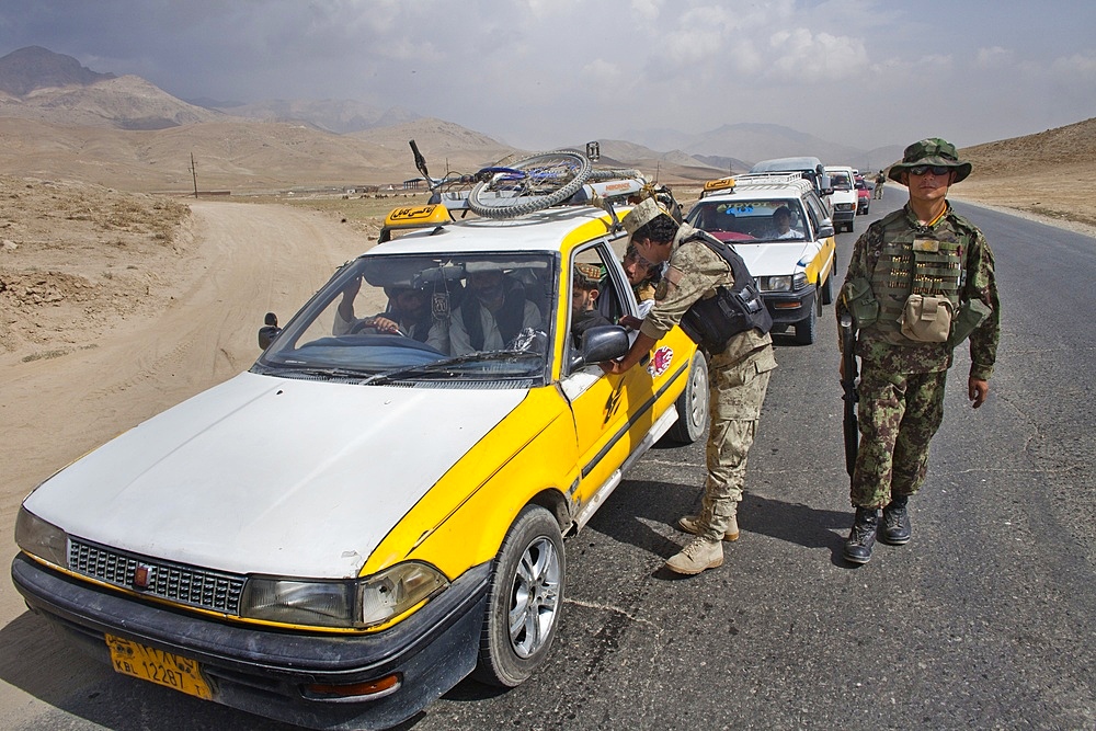 Afghan police and military checkpoint looking for suspected terrorists, just outide Maidan city.