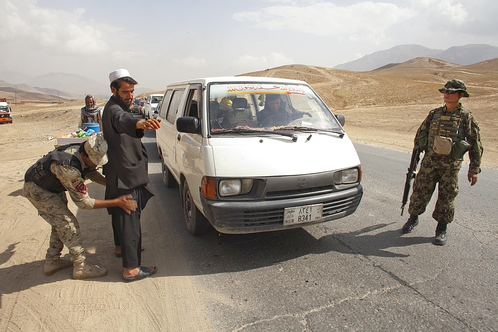 Afghan police and military checkpoint looking for suspected terrorists