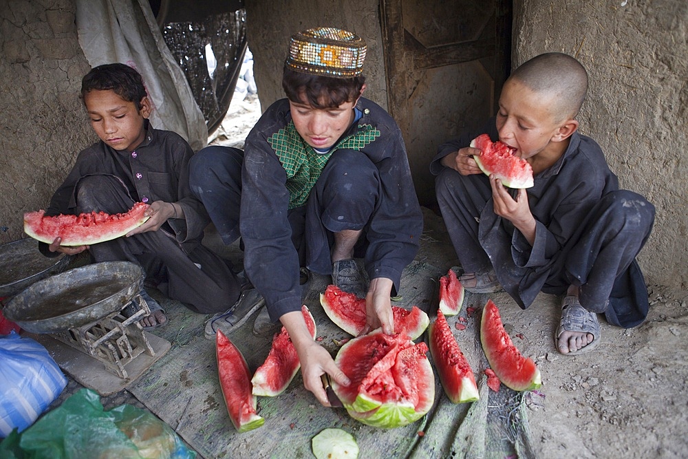 Mohammed KasimAfghans eating a water-melon