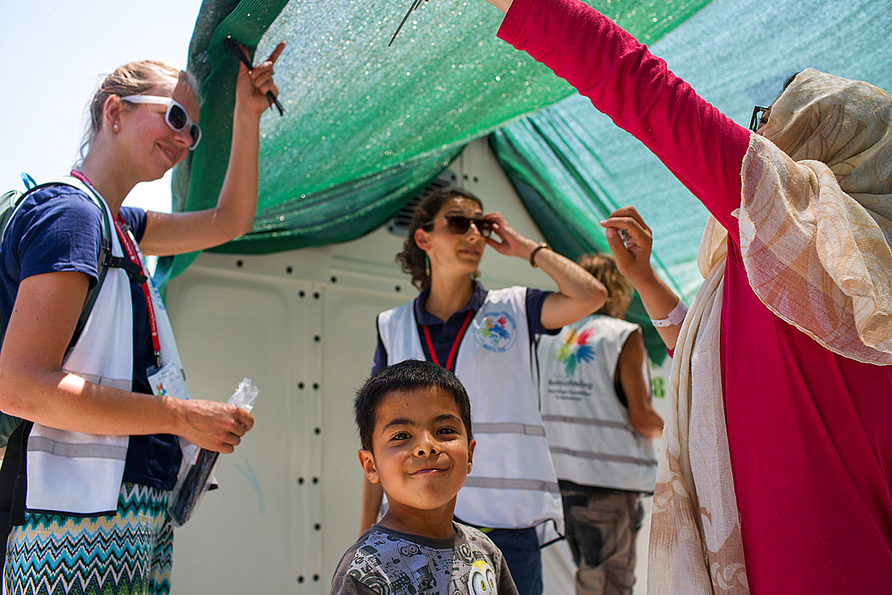 shades being distributed by Boat Refugee Foundation in Tara Tepe refugee camp in Greece