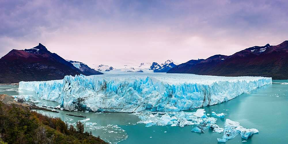 A panoramic view of Perito Moreno Glacier in Los Glaciares National Park near El Calafate, Argentina.  A UNESCO World Heritage Site in the Patagonia region of South America.  At left is Cerro Moreno and the Cordon Reichert at right.  In the background are Cerro Gardener, Teniente Iglesias and Cerro Dos Picos.