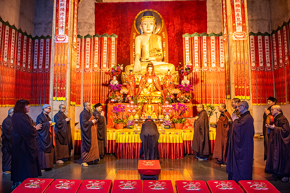 People at Jing'an Temple performing a religious ceremony, Shanghai, China