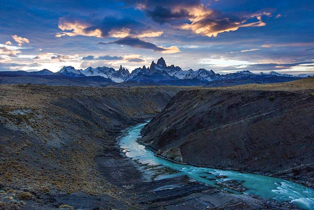 The Fitz Roy Massif at sunset, viewed over the canyon of the Rio de las Vueltas in Los Glaciares National Park near El Chalten, Argentina.  A UNESCO World Heritage Site in the Patagonia region of South America.