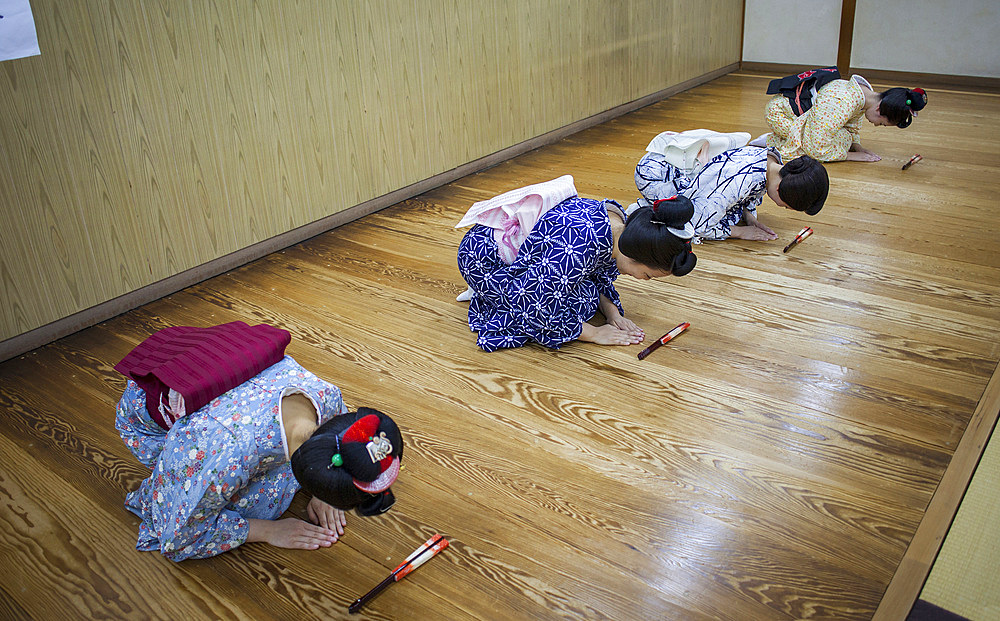 Geishas and 'maikos' (geisha apprentice) in dance class. Geisha school(Kaburenjo) of Miyagawacho.Kyoto.Kansai, Japan.