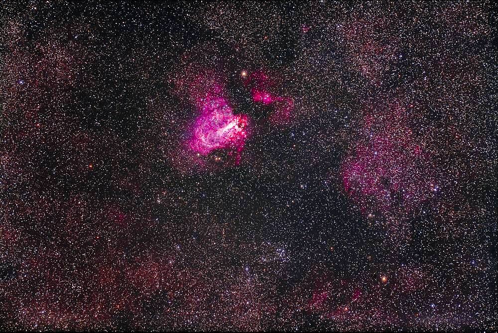 Messier 17, the Swan Nebula, aka the Omega or Checkmark Nebula, with the open cluster M18 below it.