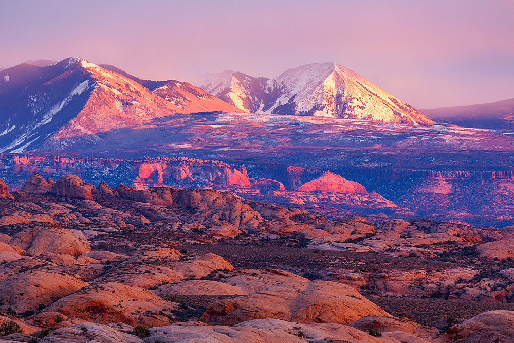 The Petrified Dunes in Arches National Park with the snow-capped La Sal Mountains behind. Moab, Utah.