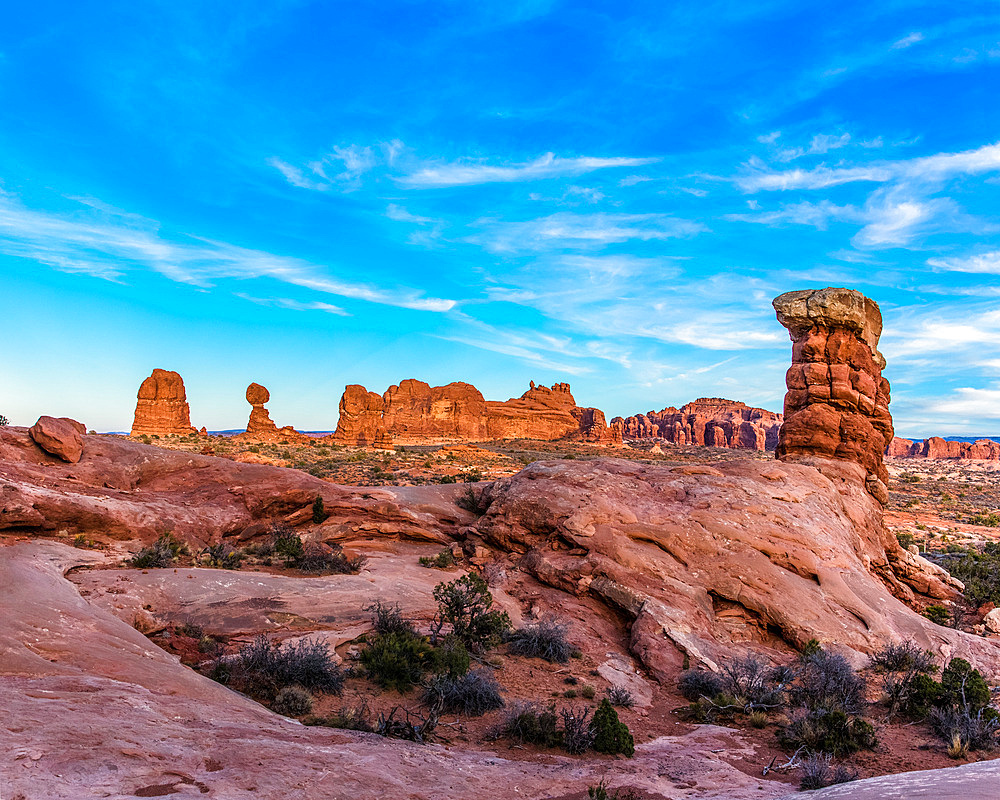 Balanced Rock as viewed from the sotheast with another sandstone pillar in the foreground in Arches National Park, Moab, Utah.