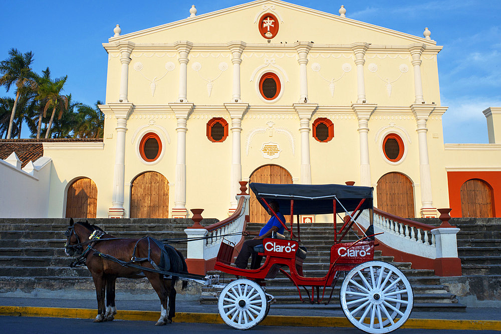 Horse drawn carriages next to La Merced church in the Spanish colonial city of Granada Nicaragua Central America