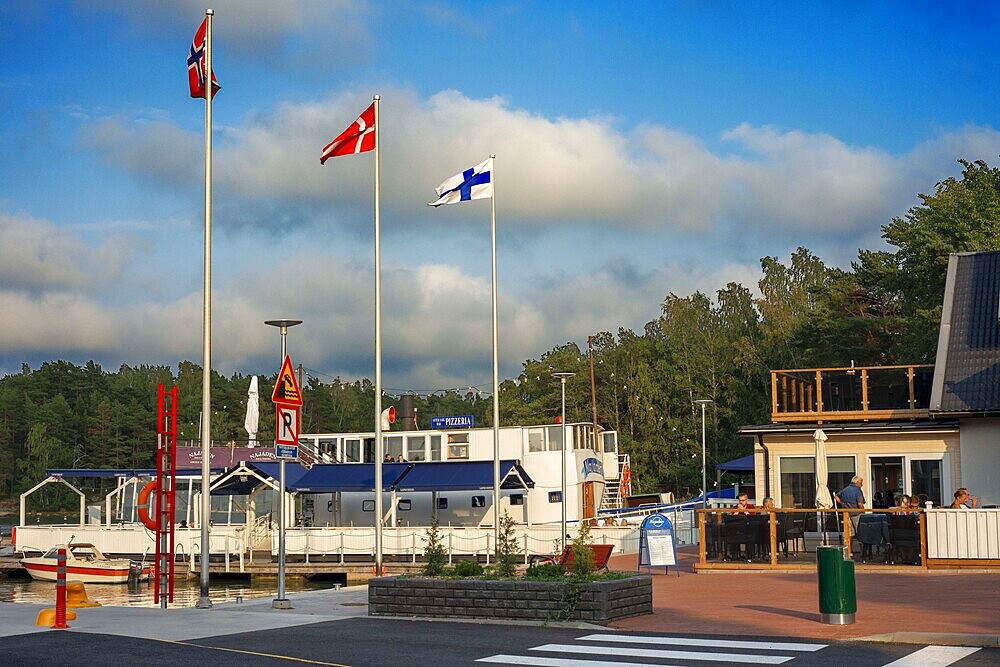 Pizzeria Restaurant in Nagu harbour or Nauvo island in Väståboland in Pargas in Southwest Finland Turku archipelago. The archipelago ring road or Saariston rengastie is full of things to see, do and do. The Archipelago Trail can be taken clockwise or counter clockwise, starting in the historical city of Turku, and continuing through rural archipelago villages and astonishing Baltic Sea sceneries. The Trail can be taken from the beginning of June until the end of August.