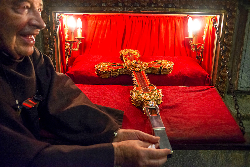 A monk at the monastery Santo Toribio in northern Spain gets out the holy relic, said to be part of the cross on which Jesus died Inside Santo Toribio de Liebana monastery. Liébana region, Picos de Europa, Cantabria Spain, Europe