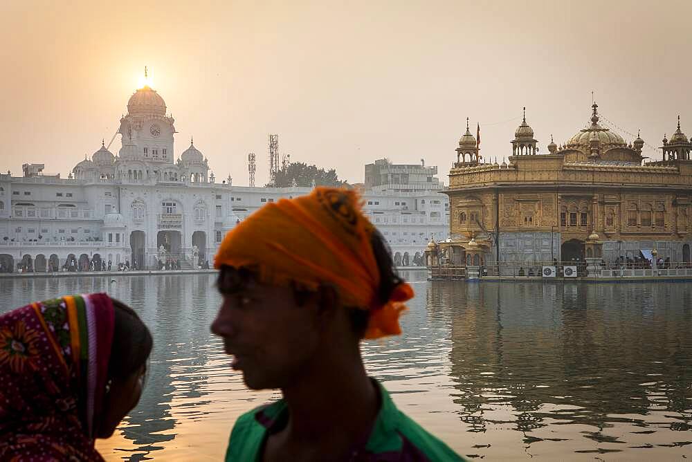 pilgrims and sacred pool Amrit Sarovar, Golden temple, Amritsar, Punjab, India