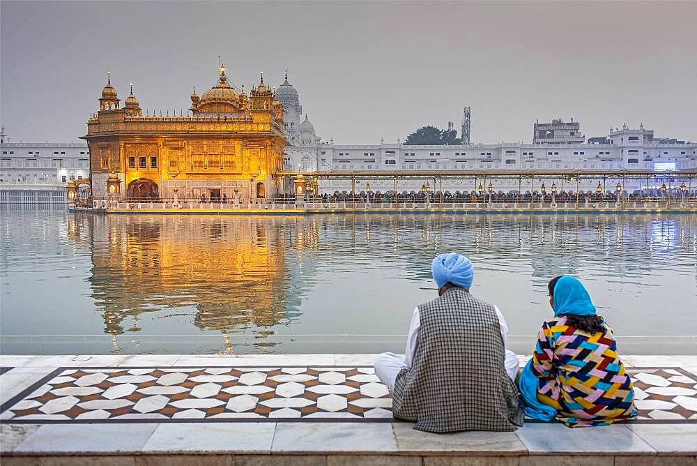 pilgrims and sacred pool Amrit Sarovar, Golden temple, Amritsar, Punjab, India