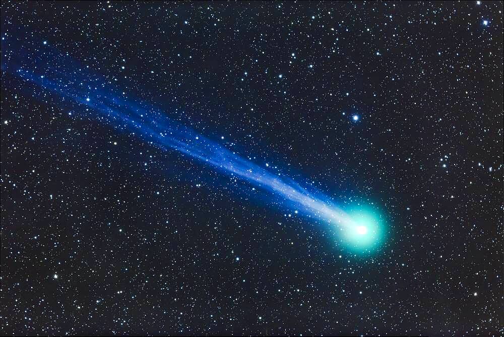 A telescopic closeup of Comet Lovejoy (C/2014 Q2) on January 19, 2015. I shot this from near Silver City, New Mexico, using a TMB 92mm apo refractor at f/4.4 and using a Canon 6D at ISO 1600 for a stack of 4 x 5 minute exposures. The ion tail is primarily from a single exposure to minimize blurring from the comet's motion relative to the stars. The rest of the image is from the stacked combination to minimize noise.