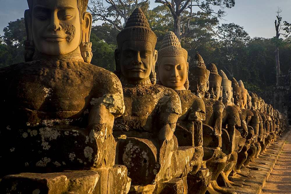 Detail, statues of Asuras on bridge of South Gate, in Angkor Thom, Siem Reap, Cambodia