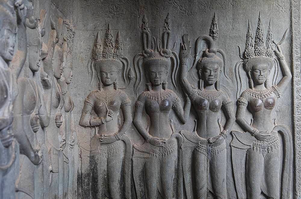 Aspara sculptures in bas-relief on the wall, in Angkor Wat, Siem Reap, Cambodia