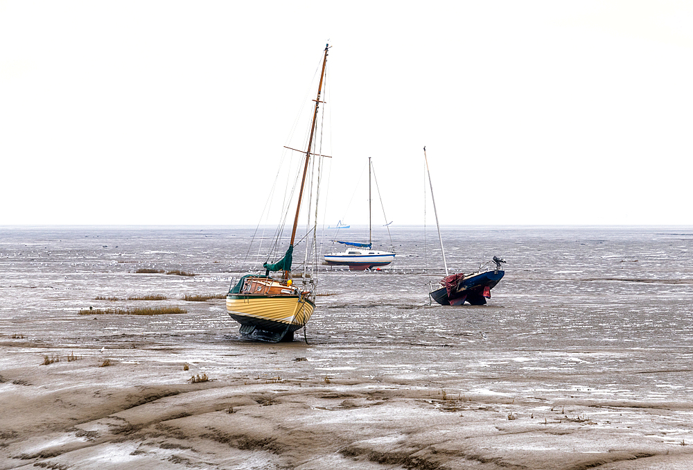 Beached boats at the low tide at Leigh on Sea, Essex, England, United Kingdom, Europe