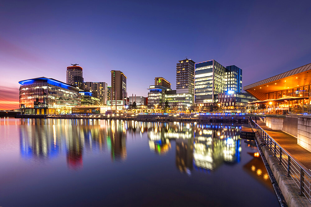 MediaCityUK reflected in North Bay at night, Salford Quays, Salford, Manchester, England, United Kingdom, Europe