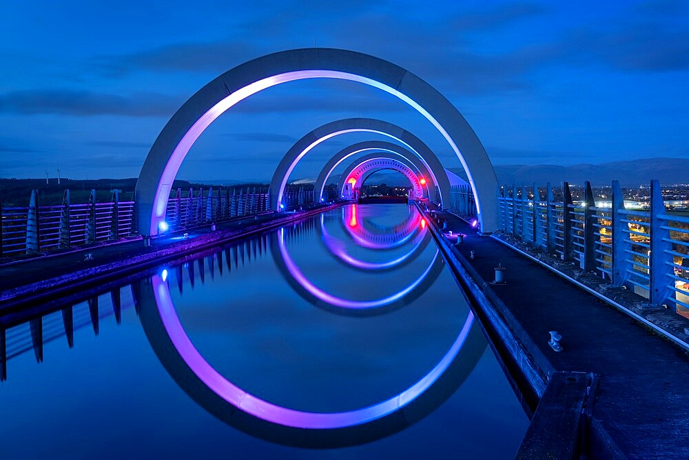 The Falkirk Wheel on the Union Canal illuminated at night, Falkirk, Stirlingshire, Scotland, United Kingdom, Europe