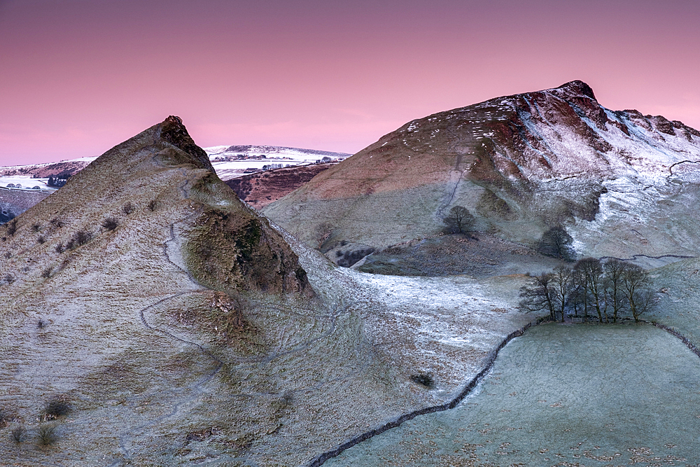 First light of dawn illuminates the peaks of Parkhouse and Chrome Hills in winter, Peak District National Park, Derbyshire, England, United Kingdom, Europe