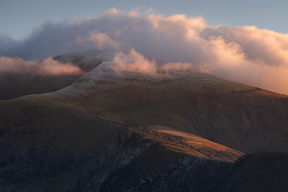 Mount Snowdon (Yr Wyddfa) at sunset in winter, Eryri or Snowdonia National Park, North Wales, UK