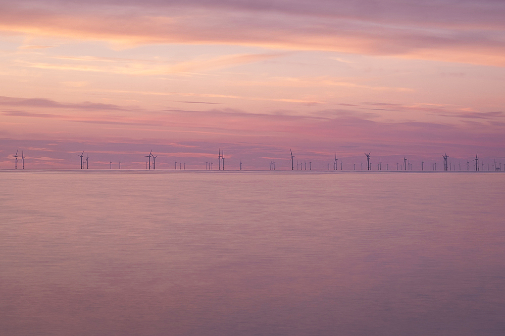 Wind Turbines of the Gwynt y Mor Offshore Wind Farm at sunset, Irish Sea, North Wales Coast, UK