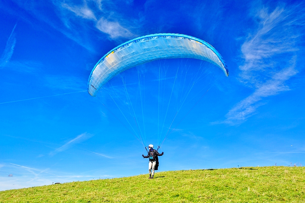 Paraglider taking off at Mount Caburn, near Lewes, East Sussex, England, United Kingdom, Europe