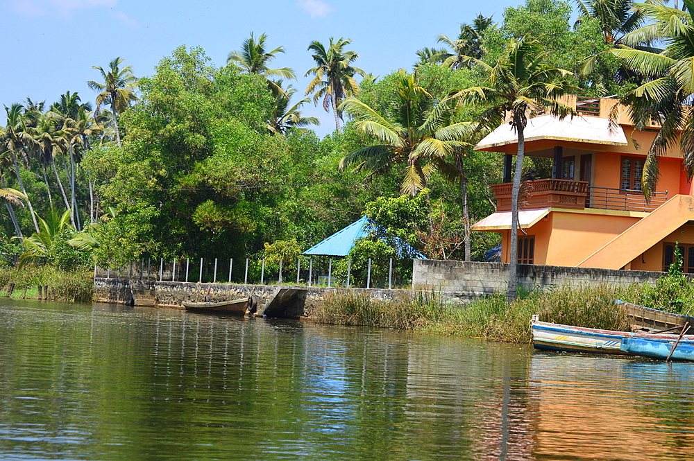 A beautiful house of small coastal village with Neyyar river backwater and amazingly lush green vegetation, Poover, Kerala, India, Asia