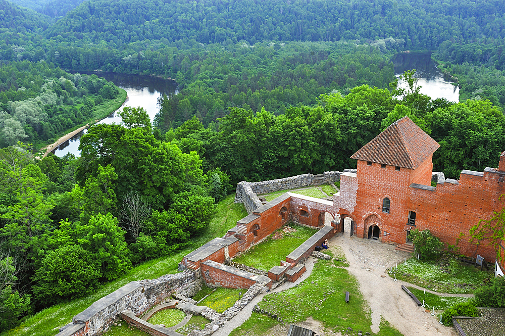 Medieval brick castle overhanging the Gauja River, Turaida Museum Reserve, Sigulda,Gauja National Park, Vidzeme Region, Latvia, Baltic region, Europe