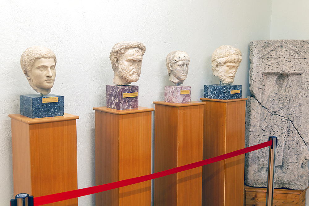 Carved marble Roman portrait heads of four men, Archaeology Museum, Apollonia Archaeological Park, Albania, Europe