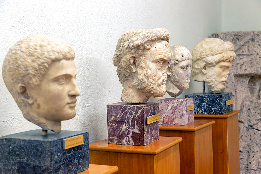 Carved marble Roman portrait heads of four men, Archaeology Museum, Apollonia Archaeological Park, Albania, Europe