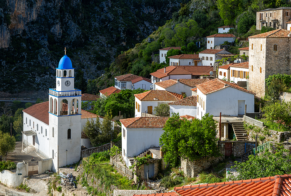 View over houses and rooftops to Greek Orthodox Church of Saint Spyridon, village of Dhermi, Albania, Europe