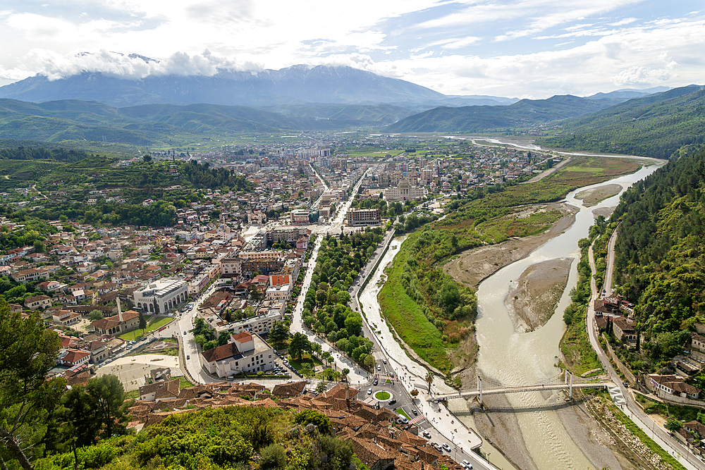 View looking over city centre of Berat in valley of River Osum with mountains beyond, Berat, Albania, Europe