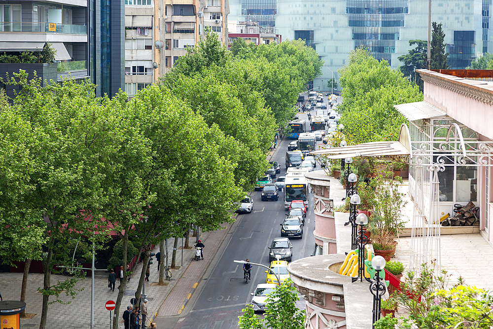 Looking down on vehicle traffic of cars taxis and buses in city centre of Tirana, Albania, Europe