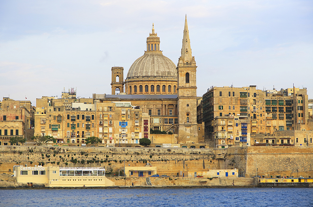 Soft evening light on buildings and churches, including dome of the Basilica of Our Lady of Mount Carmel church, UNESCO World Heritage Site, Valletta, Malta, Mediterranean, Europe