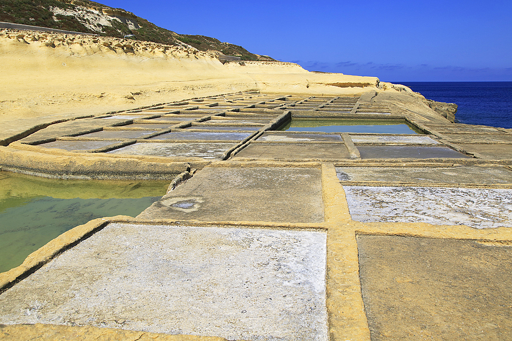 Historic ancient salt pans on coast near Marsalforn, island of Gozo, Malta, Mediterranean, Europe