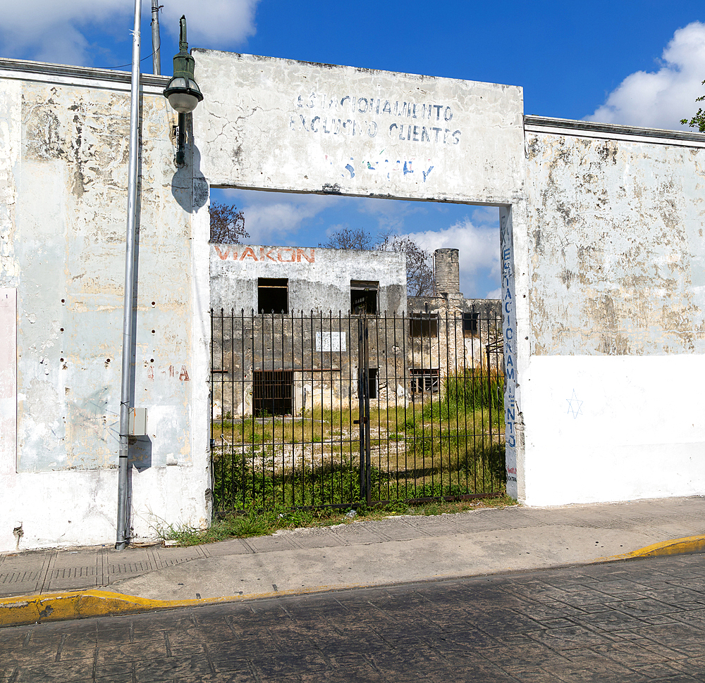 Derelict buildings closed public parking site near city centre, Merida, Yucatan State, Mexico, North America