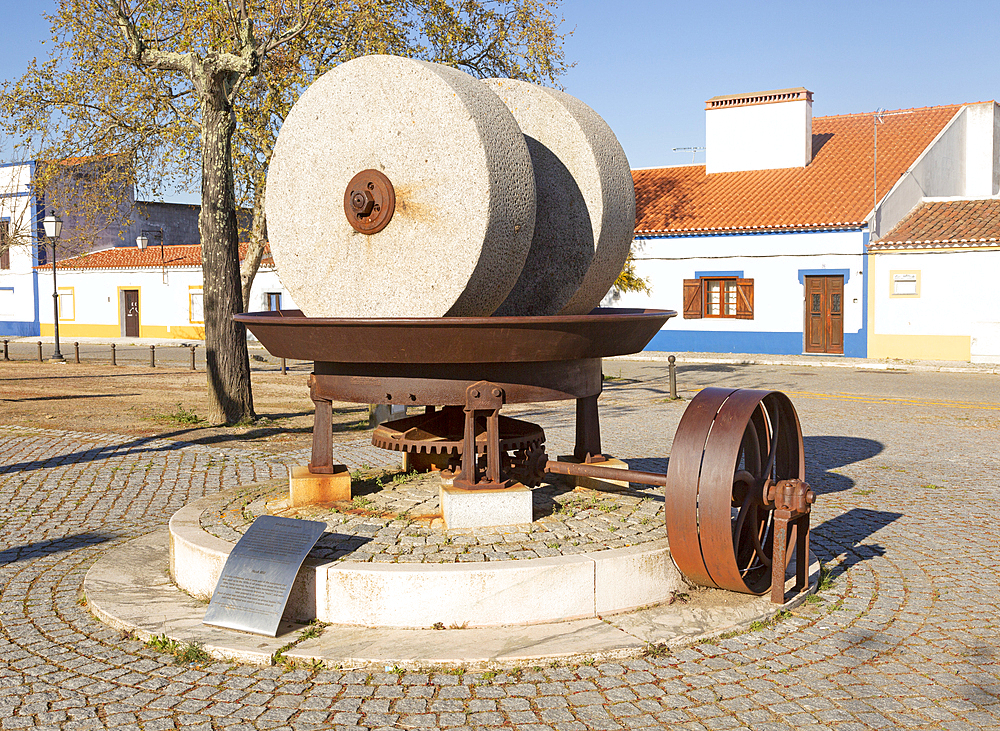 Husk mill, historic olive oil press with granite millstones used until 1970s now a heritage monument to a former industrial past, village of Alvito, Beja district, Baixa Alentejo, Portugal, Europe