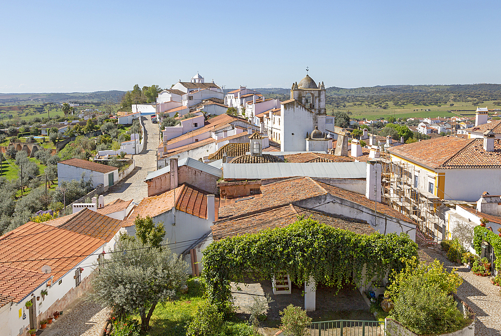 View over rooftops of whitewashed houses and streets in the small rural settlement village of Terena, Alentejo Central, Portugal, Europe