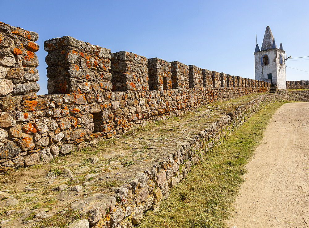 Battlements, stone ramparts and watch tower in historic castle ruins at Arraiolos (Pavao dos Alcaides), built in the 14th century, Alentejo, Portugal, Europe