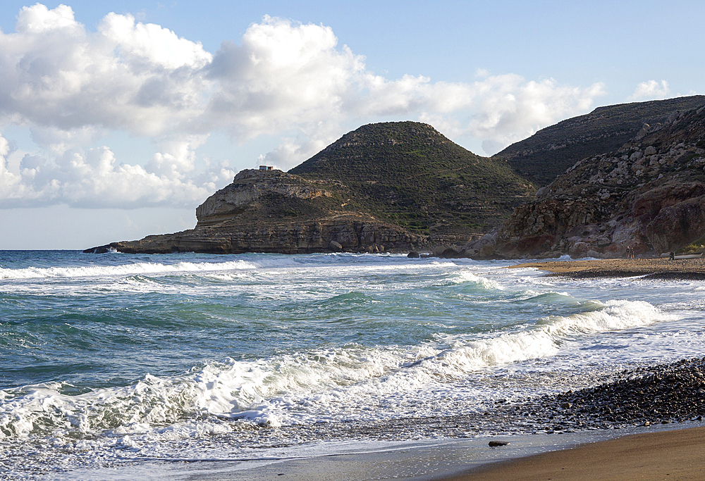 Waves breaking on sandy beach at Las Negras, Cabo de Gata Natural Park, Nijar, Almeria, Spain, Europe