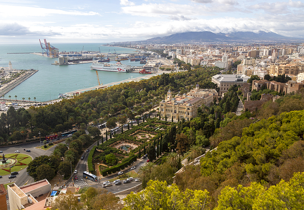 Cityscape view over city centre and dock area with Trasmediterranea ferry in port and city hall (Ayuntamiento) in centre, Malaga, Andalusia, Spain, Europe