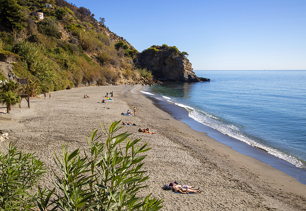 Sandy beach of Playa de Maro out of season with calm Mediterranean Sea, near Nerja, Andalusia, Spain, Europe