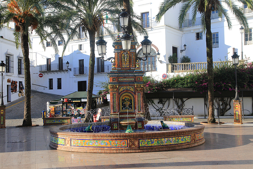 Fountain and palm trees in Plaza de Espana, Vejer de la Frontera, Cadiz Province, Spain