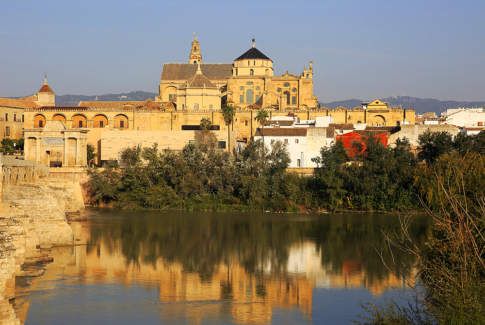 River Rio Guadalquivir and historic Mezquita cathedral buildings, Great Mosque, Cordoba, Spain